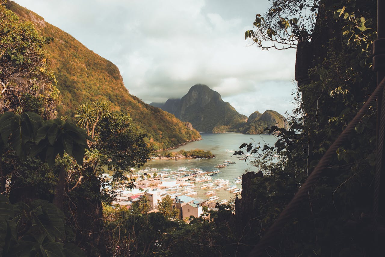 our-story Breathtaking view of El Nidos lush mountains and serene waters in the Philippines.