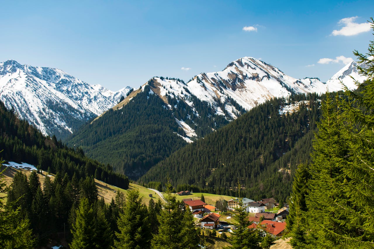 gallery-01 Idyllic village of Rinnen in Tirol, Austria, nestled among snow-capped Alps and lush forests. Perfect winter landscape.